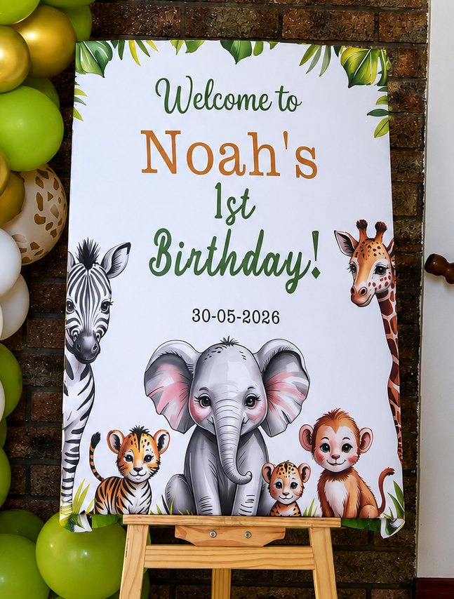 Decorative balloon arch with a birthday sign featuring animals and text.